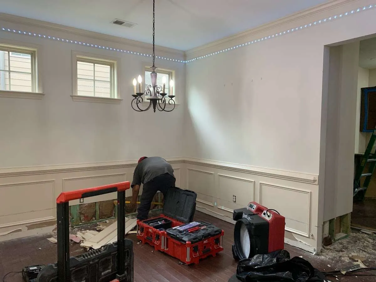 Restoration technician with professional equipment in East Haven